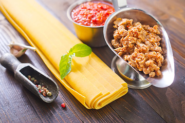 Image showing dough for lasagna and ingredients for lasagna