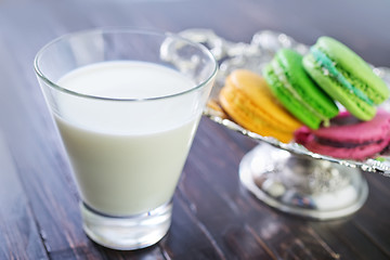 Image showing milk in glass and color macaroons