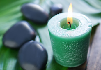 Image showing candle and stones