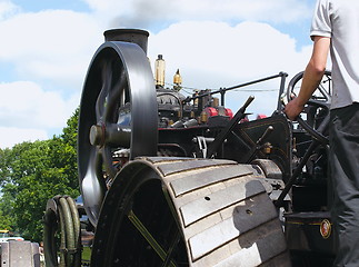 Image showing traction engine wheels and driver