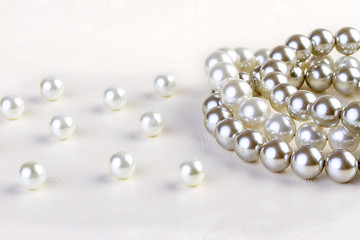Image showing Silver and White pearls necklace on white paper 