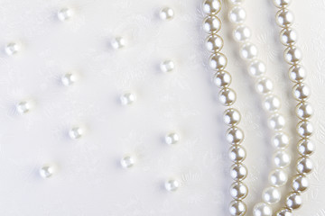 Image showing White pearls necklace on white paper  