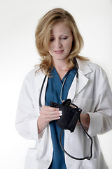 Image showing lady doctor holding blood pressure cuff