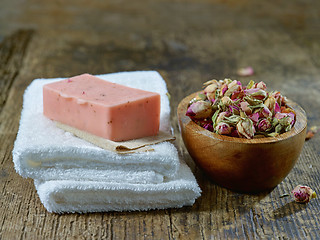 Image showing white towels and natural rose soap bar