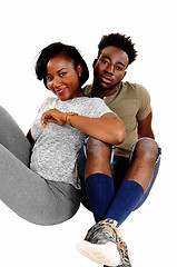 Image showing Black couple sitting on floor.