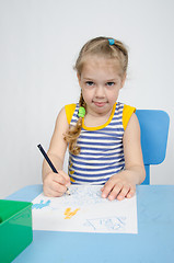 Image showing Four-year girl draws pencil drawing