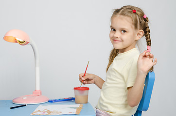 Image showing Six year old girl draws paints and waves