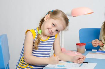 Image showing Happy little girl drawing pencils