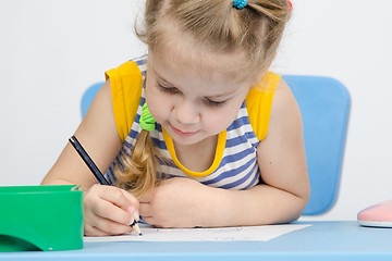 Image showing The girl draws pencil concentration