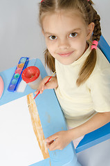 Image showing The girl drew a picture on ground