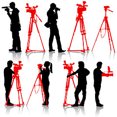 Image showing Cameraman with video camera. Silhouettes 