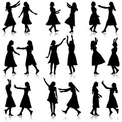 Image showing Black silhouettes of beautiful womans on white background. 