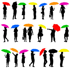 Image showing Set   silhouettes of men and women with umbrellas. illust