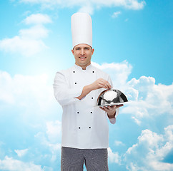 Image showing happy male chef cook holding cloche