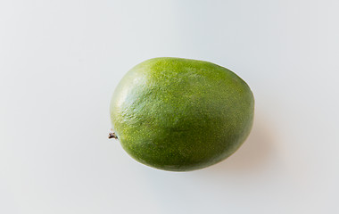 Image showing ripe green mango over white