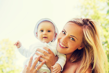 Image showing happy mother with little baby outdoors