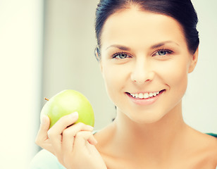 Image showing beautiful woman in the with an apple