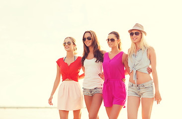 Image showing group of smiling women in sunglasses on beach