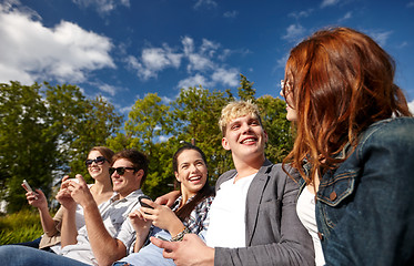 Image showing students or teenagers with smartphones at campus