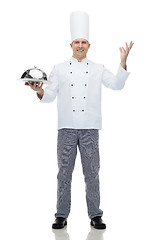 Image showing happy male chef cook holding cloche