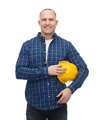 Image showing smiling man in helmet with gloves