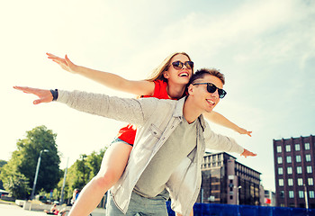 Image showing smiling couple having fun in city