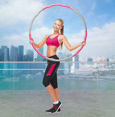 Image showing young sporty woman with hula hoop