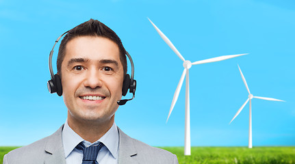 Image showing smiling businessman in headset