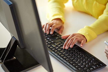 Image showing close up of female hands with computer typing