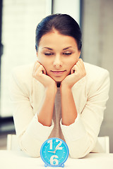 Image showing businesswoman with clock