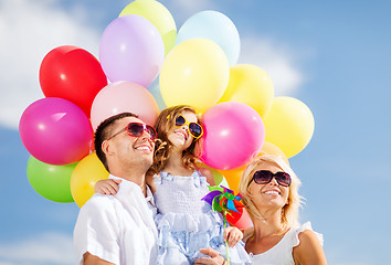 Image showing family with colorful balloons