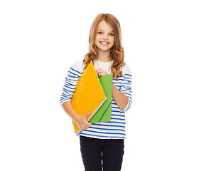 Image showing child holding colorful folders