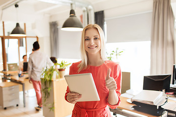 Image showing woman with tablet pc showing thumbs up at office