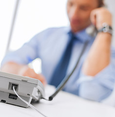 Image showing handsome businessman talking on the phone