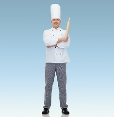 Image showing happy male chef cook holding rolling pin