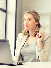 Image showing woman with laptop and finger up