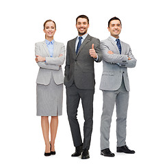 Image showing group of smiling businessmen showing thumbs up