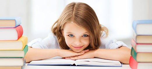 Image showing pretty girl with many books at school