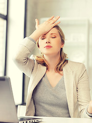 Image showing stressed woman with laptop computer