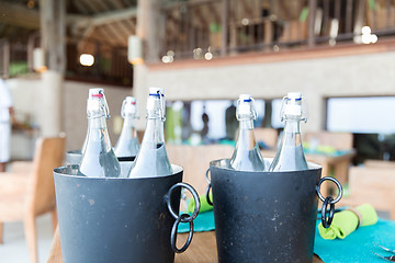 Image showing bottles of water in ice bucket at hotel restaurant