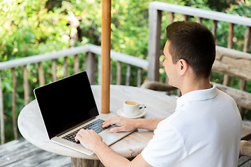 Image showing close up of businessman with laptop on terrace