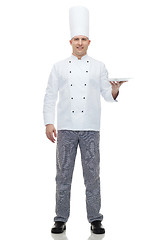 Image showing happy male chef cook showing empty plate