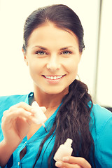 Image showing beautiful woman polishing her nails