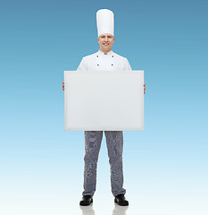 Image showing happy male chef cook holding white blank big board