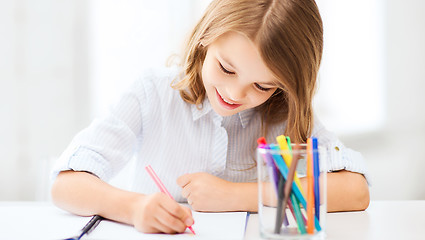 Image showing little student girl drawing at school