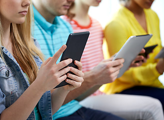 Image showing close up of students with tablet pc at school