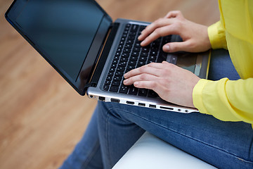 Image showing close up of woman with laptop computer at home