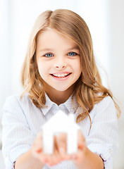 Image showing girl holding white paper house