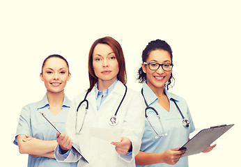 Image showing calm female doctor with clipboard