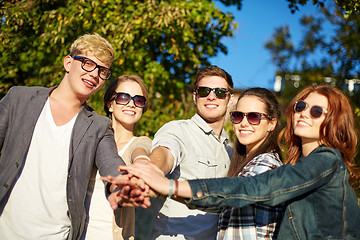 Image showing group of students or teenagers with hands on top